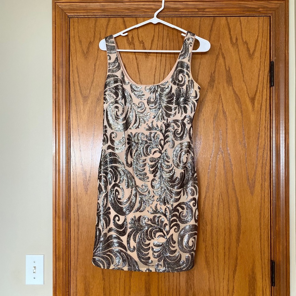 Sleek mini dress with intricate design